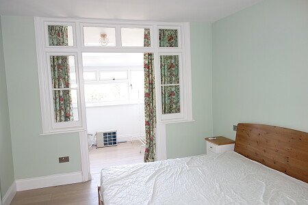 Bedroom with enclosed balcony 1