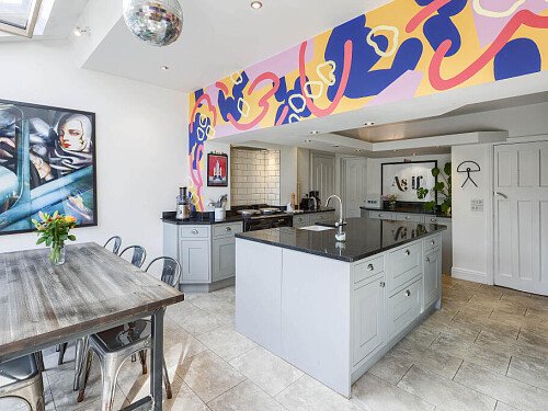 Kitchen with AGA and mural