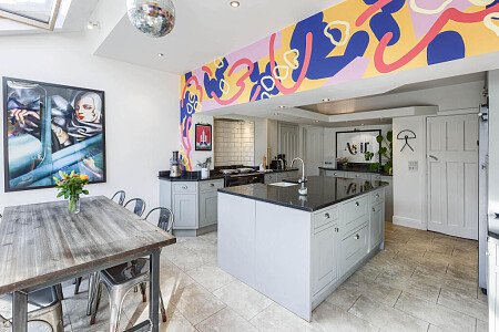 Kitchen with AGA and mural