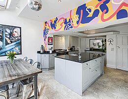 Kitchen with AGA and mural