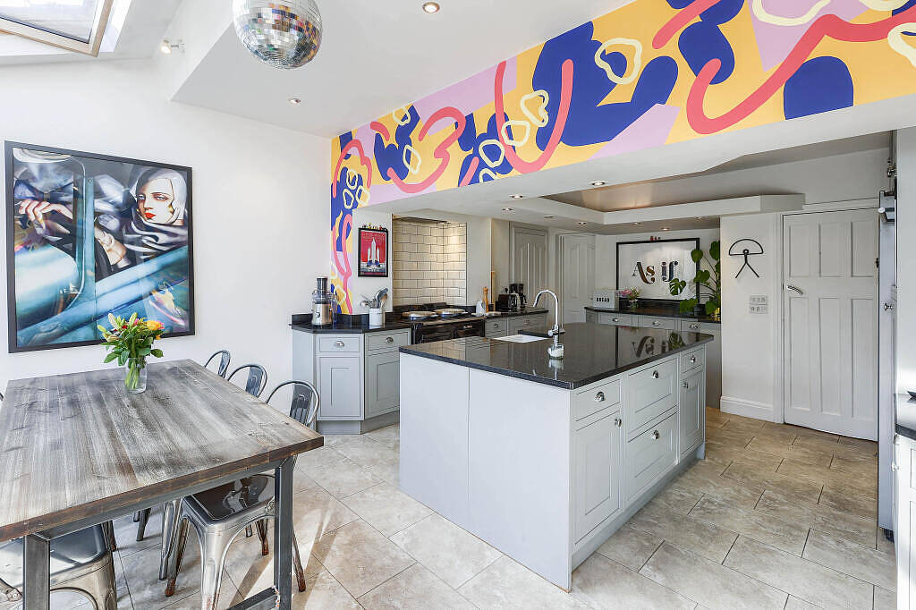 Kitchen with AGA and mural