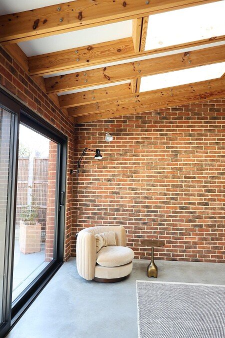 02 Main space - Red Brick, timber, Soho Home armchair