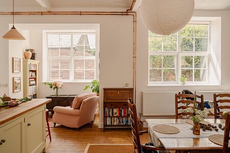 Kitchen island, copper pipework, comfy armchair, books, large windows, open plan living, restic farmhouse