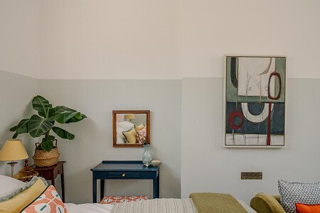 ceiling, blue room, abstract art, velvet chaise, plant