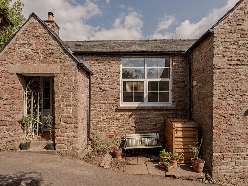 country lane, bench, stone house