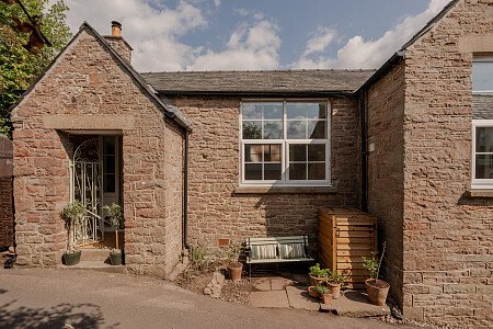 country lane, bench, stone house