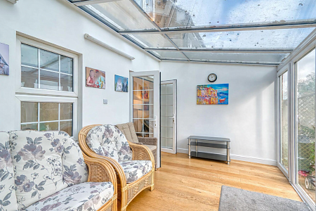 Bright conservatory with modern furnishings